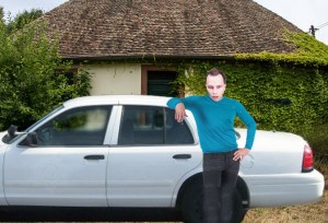 Desi Hutlinger poses with the Crown Victoria he bought at a police auction.