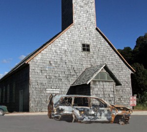 Scorched car sits in no parking zone outside Church of the 