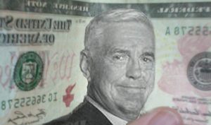 "Maximum" Bob Lutz is pictured on a prototype $20 bill. The writing on the bill is backwards because the photographer was facing the wrong direction