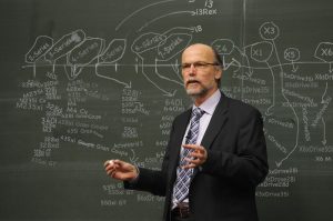 Instructor Wiede Webber explains the BMW model lineup to a class of prospective salespeople about 