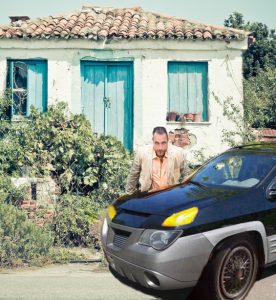 Banjo Goble poses proudly with his Aztek tribute vehicle