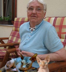 Paprika McWherter and her two bald cats, Nibbles (left) and Toby