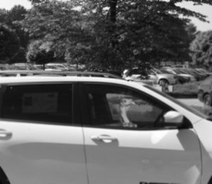 A liquor store security camera took this photo of Chum driving the stolen Jeep Cherokee