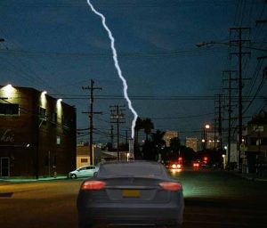 A lightning "stroke" charges a Tesla Model S. 