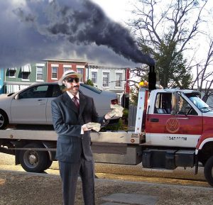 E. Blote Pacmeyer shows off the money he was paid by VW as his diesel Jetta leaves on a tow truck