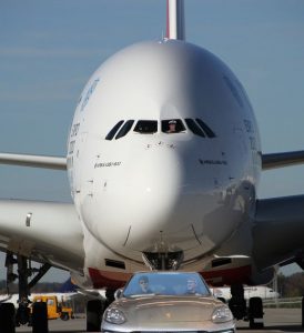 Porsche Cayenne tows a 628,000 pound Airbus. Passengers enjoyed free cocktails during the four-minute ride, and were subsequently cut off. 